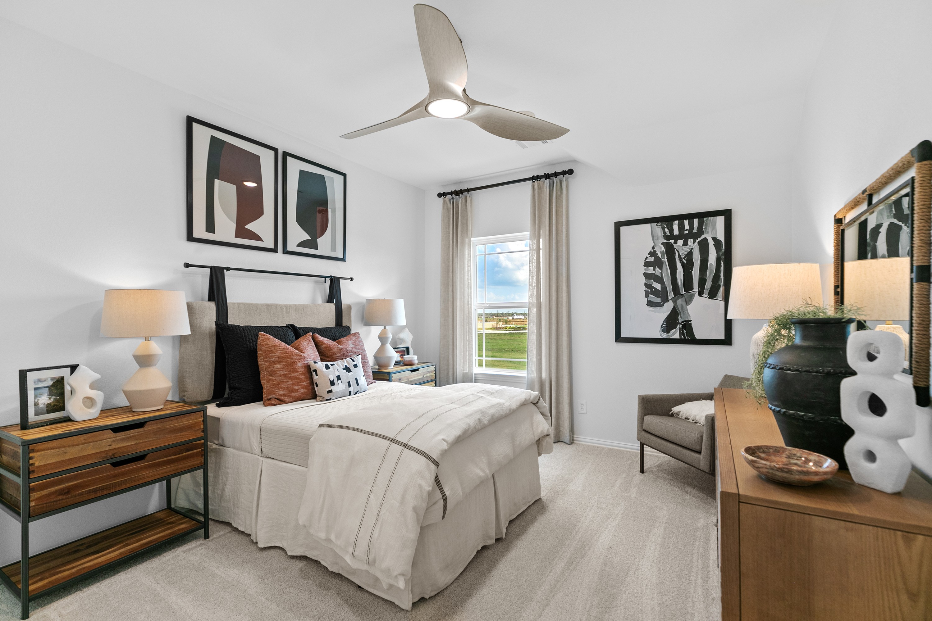 River Ranch Bedroom with Modern Art and Minimalist Design Elegant bedroom in River Ranch featuring modern art, minimalist furniture, and large window with scenic view.