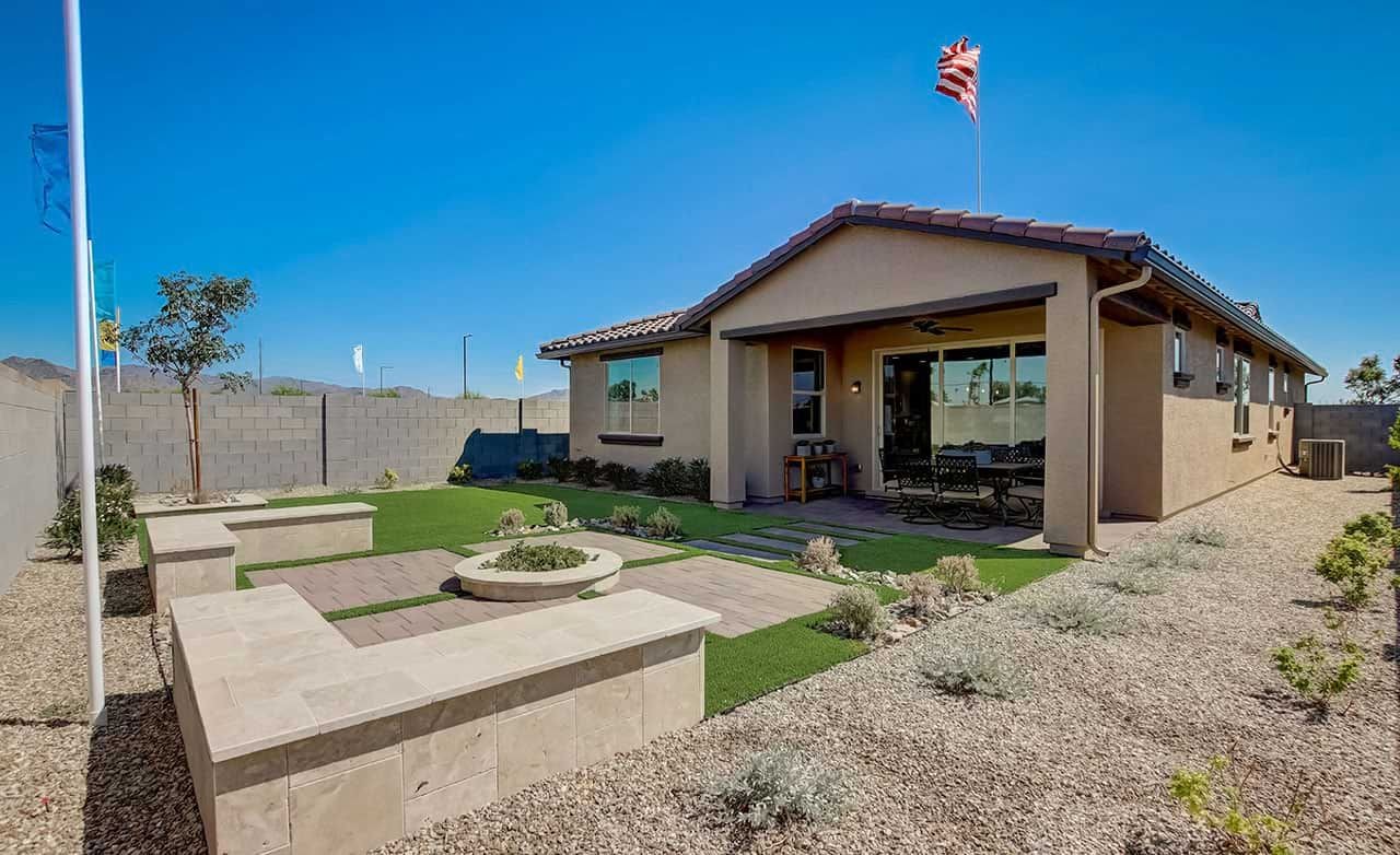 Single-Story Home with Stucco Exterior in Anderson Parc Modern single-story home with stucco exterior, patio, and desert landscaping in Anderson Parc.