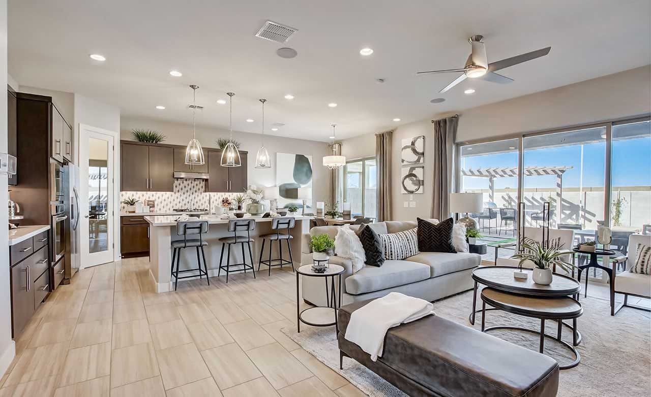 Elegant Open-Plan Living Area in Mirada Crossing with Modern Kitchen Modern open-plan living area with sleek kitchen island, Mirada Crossing, large windows, elegant light fixtures.
