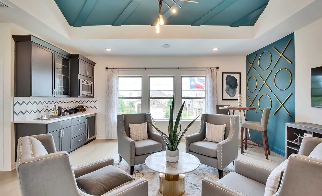 Modern Living Room in Oaks at San Gabriel, Texas Elegant living room with blue coffered ceiling, modern decor; Oaks at San Gabriel community, Texas.